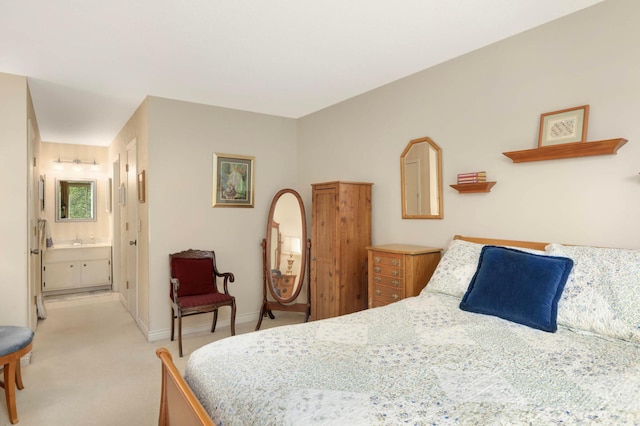 4201 Lakeside Ave N Unit 317, Brooklyn Center, MN 55429 - bedroom featuring light colored carpet, baseboards, and ensuite bathroom