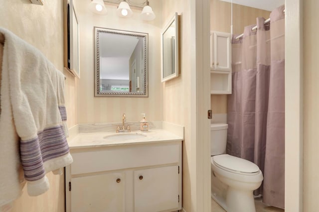 4201 Lakeside Ave N Unit 317, Brooklyn Center, MN 55429 - bathroom with toilet, vanity, and curtained shower