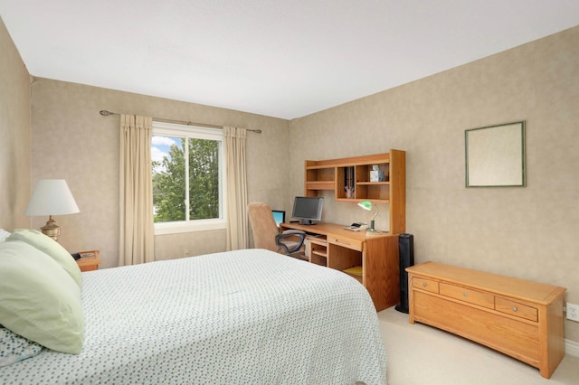 4201 Lakeside Ave N Unit 317, Brooklyn Center, MN 55429 - bedroom with light colored carpet, a desk, and baseboards