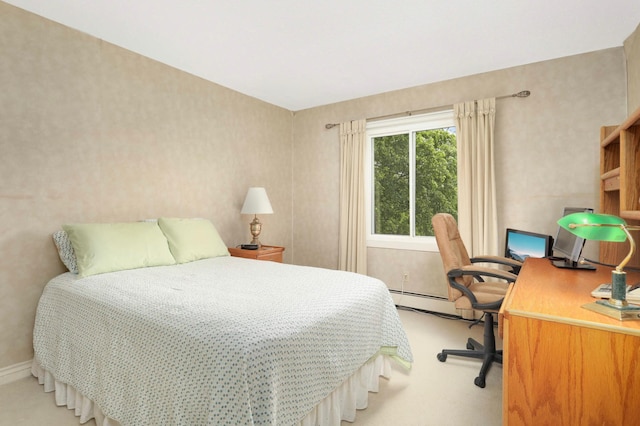 4201 Lakeside Ave N Unit 317, Brooklyn Center, MN 55429 - bedroom featuring light carpet, baseboard heating, baseboards, a desk, and wallpapered walls