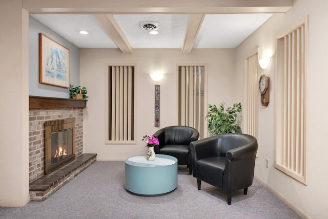 4201 Lakeside Ave N Unit 317, Brooklyn Center, MN 55429 - carpeted living room featuring beamed ceiling, baseboards, a fireplace, and recessed lighting