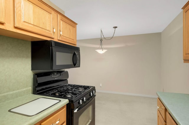 4201 Lakeside Ave N Unit 317, Brooklyn Center, MN 55429 - kitchen with black appliances, light colored carpet, light countertops, baseboards, and pendant lighting