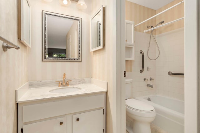 4201 Lakeside Ave N Unit 317, Brooklyn Center, MN 55429 - bathroom with wallpapered walls, vanity, toilet, and bathtub / shower combination