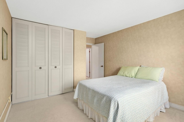 4201 Lakeside Ave N Unit 317, Brooklyn Center, MN 55429 - bedroom with light carpet, a closet, and baseboards