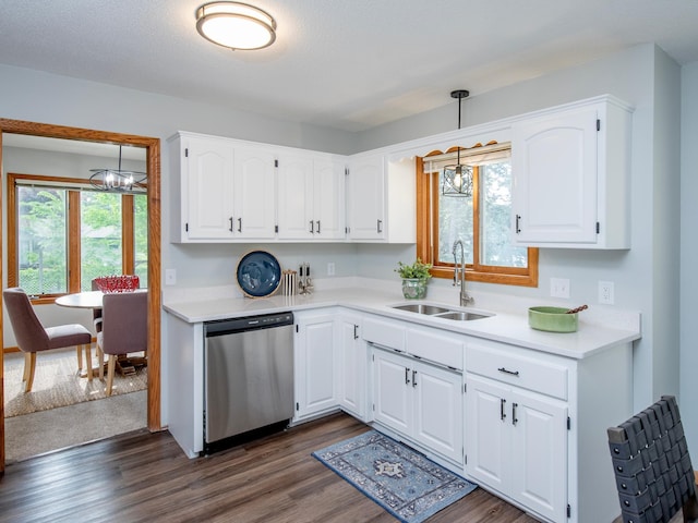 7808 Sunkist Blvd, Brooklyn Park, MN 55444 - kitchen featuring stainless steel dishwasher, a sink, dark wood-style floors, light countertops, and white cabinets