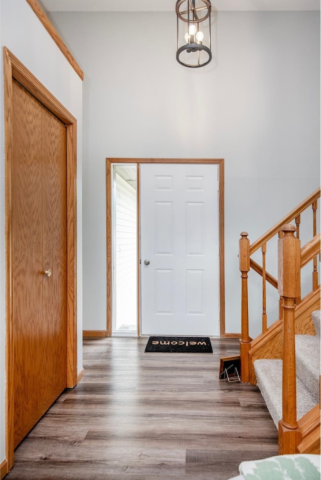 7808 Sunkist Blvd, Brooklyn Park, MN 55444 - entrance foyer with stairs, wood finished floors, and baseboards