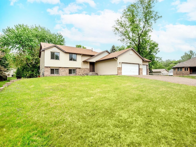 7808 Sunkist Blvd, Brooklyn Park, MN 55444 - tri-level home with driveway, a front yard, an attached garage, and brick siding