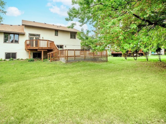 7808 Sunkist Blvd, Brooklyn Park, MN 55444 - view of green lawn with a deck and stairway