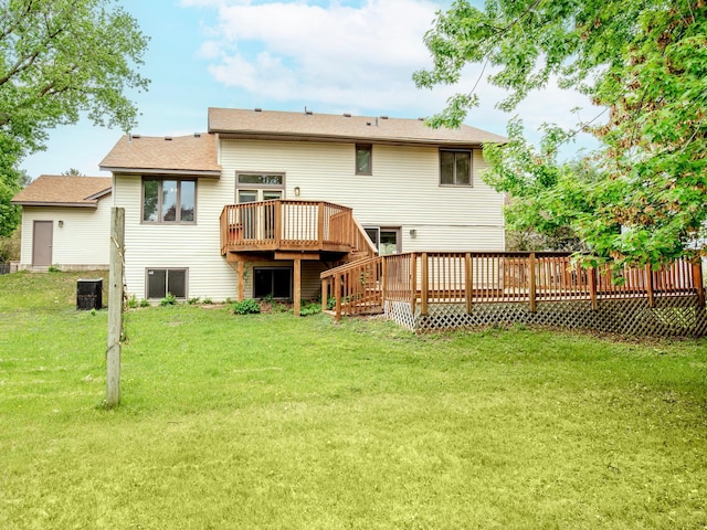 7808 Sunkist Blvd, Brooklyn Park, MN 55444 - back of property featuring a deck, a yard, and stairway