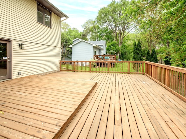 7808 Sunkist Blvd, Brooklyn Park, MN 55444 - wooden deck featuring view of scattered trees