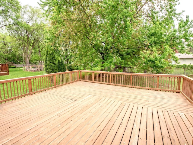 7808 Sunkist Blvd, Brooklyn Park, MN 55444 - wooden terrace featuring view of scattered trees