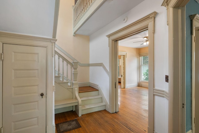 709 7th St SE, Minneapolis, MN 55414 - stairs with hardwood / wood-style floors, ceiling fan, and baseboards