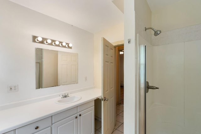 709 7th St SE, Minneapolis, MN 55414 - full bathroom featuring a shower, tile patterned flooring, and vanity