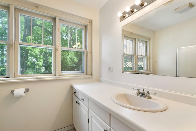 709 7th St SE, Minneapolis, MN 55414 - bathroom featuring healthy amount of natural light and vanity