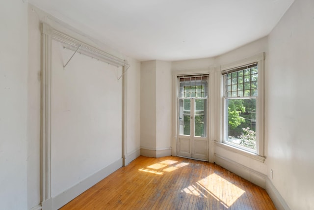 709 7th St SE, Minneapolis, MN 55414 - spare room with hardwood / wood-style floors and baseboards
