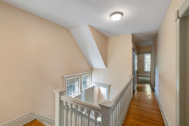 709 7th St SE, Minneapolis, MN 55414 - corridor with an upstairs landing, wood finished floors, and baseboards