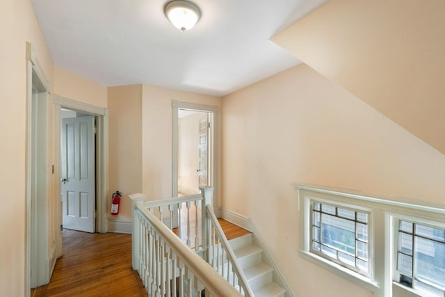 709 7th St SE, Minneapolis, MN 55414 - corridor featuring an upstairs landing, wood finished floors, and baseboards
