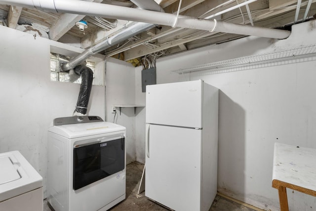709 7th St SE, Minneapolis, MN 55414 - unfinished below grade area featuring freestanding refrigerator, electric panel, and washer and clothes dryer