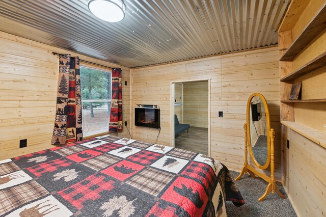 24625 Fosmo Dr, La Follette Twp, WI 54893 - carpeted bedroom featuring wood walls and wooden ceiling