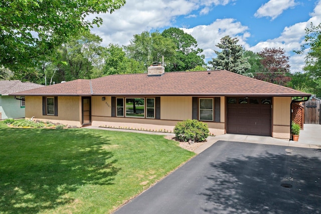 8007 5th St NE, Spring Lake Park, MN 55432 - ranch-style house with a garage, a chimney, a front yard, and asphalt driveway