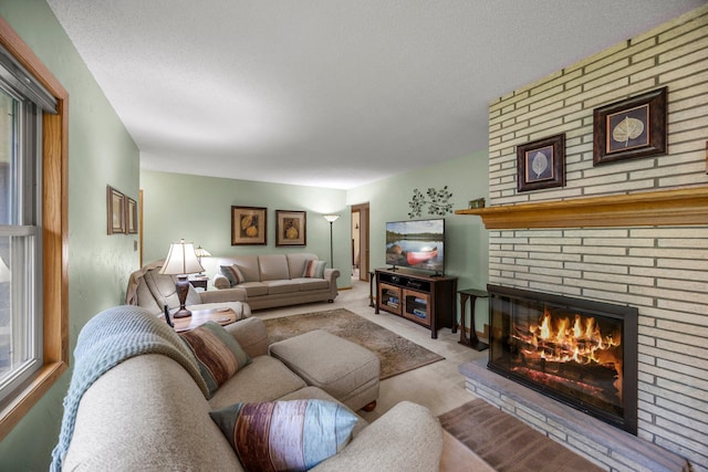8007 5th St NE, Spring Lake Park, MN 55432 - living area with a brick fireplace, carpet floors, a textured ceiling, and healthy amount of natural light