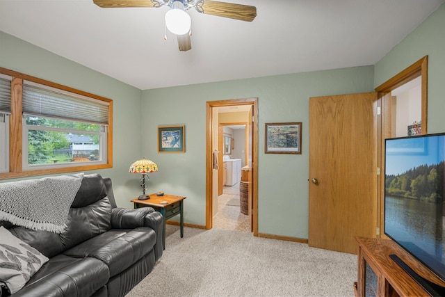 8007 5th St NE, Spring Lake Park, MN 55432 - living area featuring light carpet, ceiling fan, and baseboards