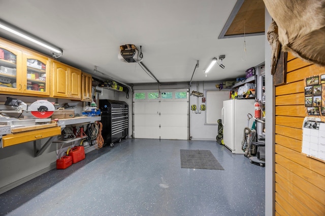 8007 5th St NE, Spring Lake Park, MN 55432 - garage featuring freestanding refrigerator and a garage door opener