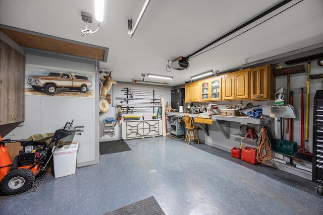 8007 5th St NE, Spring Lake Park, MN 55432 - garage with a workshop area and a garage door opener