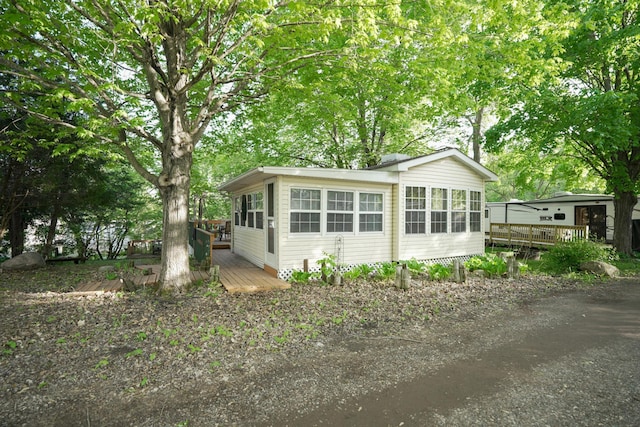 32741 Lakes Trl Unit 11A, Chisago Lake Twp, MN 55045 - view of side of home with a wooden deck