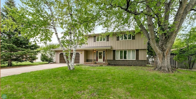 3667 Evergreen Rd N, Fargo, ND 58102 - traditional-style house featuring concrete driveway and brick siding