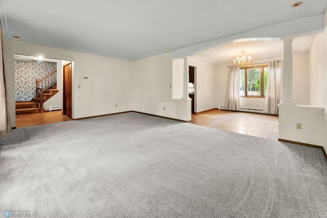 3667 Evergreen Rd N, Fargo, ND 58102 - unfurnished living room with ornamental molding, a chandelier, ornate columns, stairway, and carpet