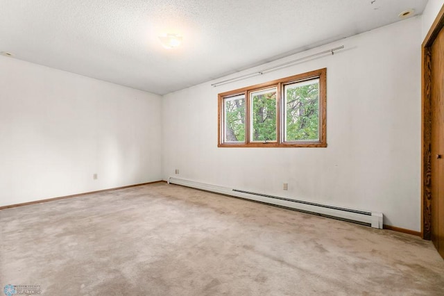 3667 Evergreen Rd N, Fargo, ND 58102 - empty room with a baseboard radiator, carpet, baseboards, and a textured ceiling