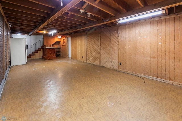 3667 Evergreen Rd N, Fargo, ND 58102 - finished below grade area with freestanding refrigerator, stairs, and wood walls