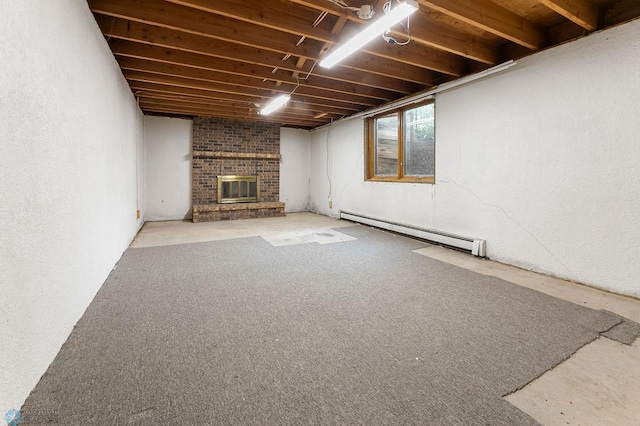 3667 Evergreen Rd N, Fargo, ND 58102 - basement with baseboard heating and a fireplace
