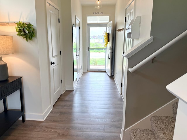 1072 Shoreview Dr, Jordan, MN 55352 - foyer entrance with wood finished floors, baseboards, and stairway