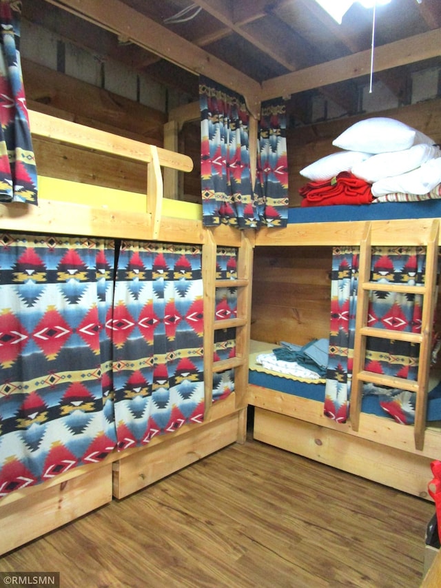 bedroom featuring wood finished floors