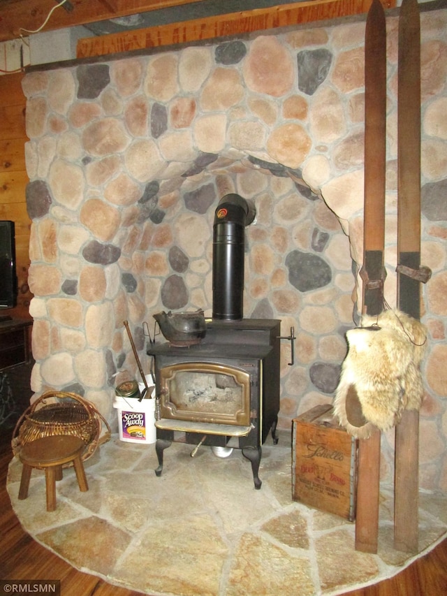 detailed view of a wood stove and wood finished floors