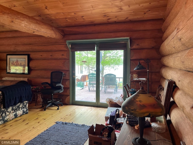 bedroom featuring access to exterior, hardwood / wood-style flooring, an office area, rustic walls, and wood ceiling