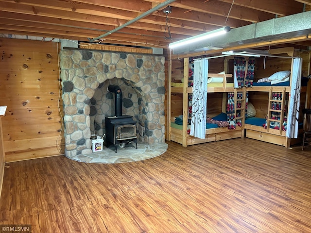 4701 Shangri La Dr NE, Wabedo Twp, MN 56655 - basement featuring a wood stove and wood finished floors