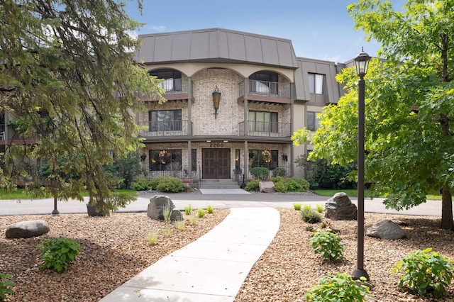 2200 Nevada Ave S Unit 313, Saint Louis Park, MN 55426 - view of front of house featuring a balcony and brick siding