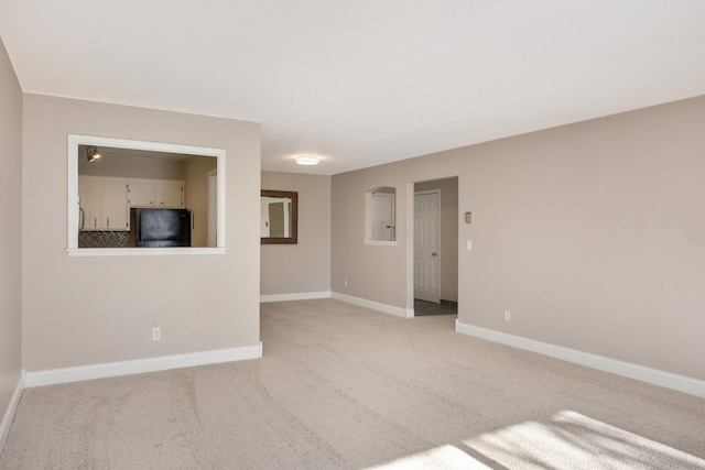 2200 Nevada Ave S Unit 313, Saint Louis Park, MN 55426 - spare room featuring light colored carpet and baseboards