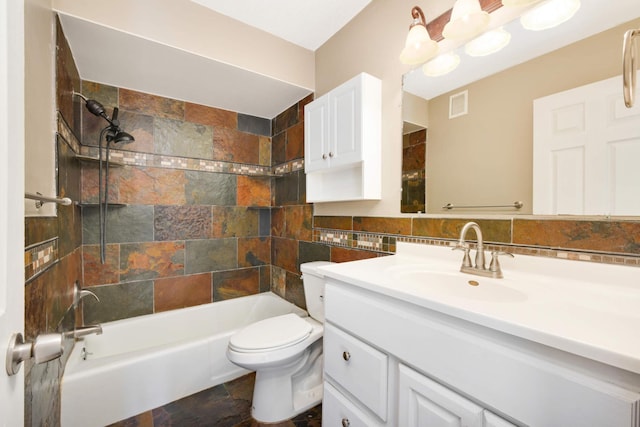 2200 Nevada Ave S Unit 313, Saint Louis Park, MN 55426 - bathroom featuring vanity, toilet, bathing tub / shower combination, tile walls, and stone finish flooring