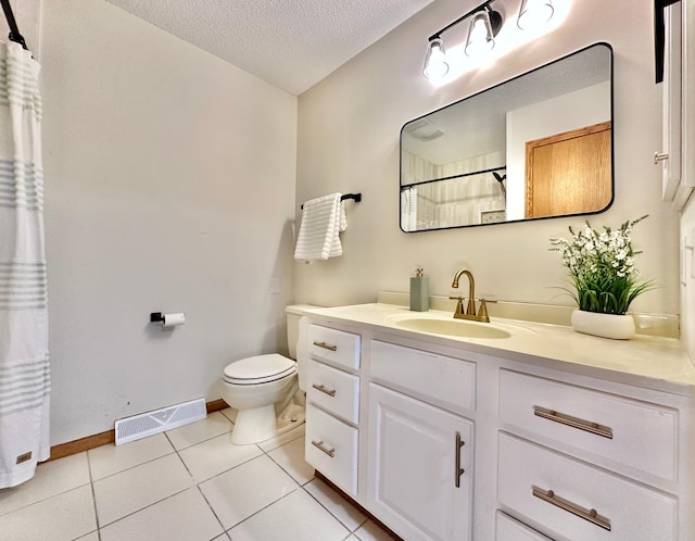 full bath featuring toilet, a textured ceiling, tile patterned flooring, vanity, and baseboards