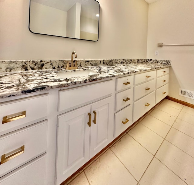 bathroom featuring vanity and tile patterned flooring