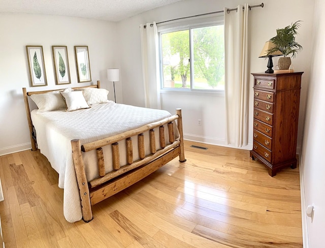 3568 Cloman Way, Inver Grove Heights, MN 55076 - bedroom with light wood-style floors and baseboards