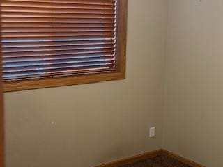 5047 Florence Dr NW, Rochester, MN 55901 - empty room with baseboards