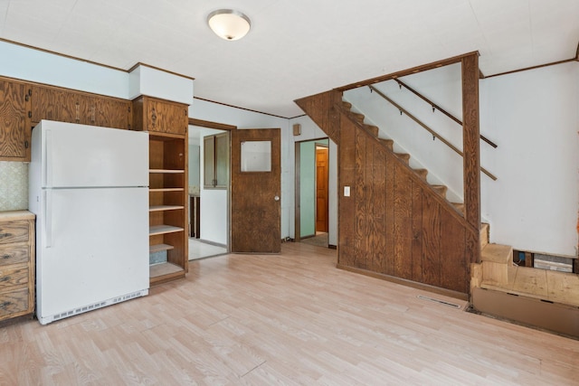W11651 State Road 35, Oak Grove Twp, WI 54021 - unfurnished living room with light wood-type flooring and stairs