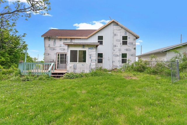 W11651 State Road 35, Oak Grove Twp, WI 54021 - back of property featuring a wooden deck and a lawn