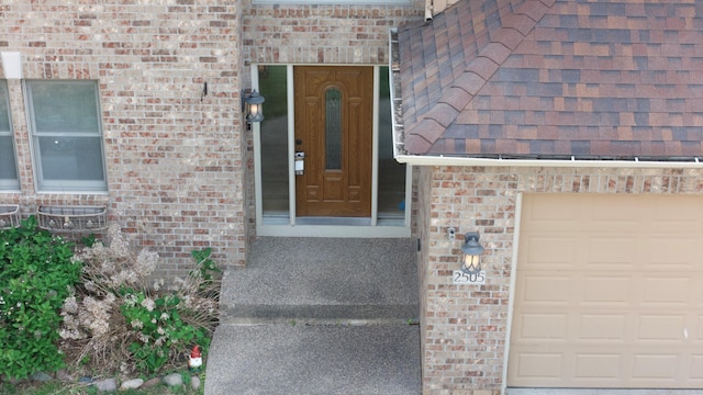 2505 Christian Dr, Chaska, MN 55318 - property entrance with a garage, brick siding, and roof with shingles