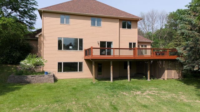 2505 Christian Dr, Chaska, MN 55318 - back of house featuring a yard, a wooden deck, and roof with shingles